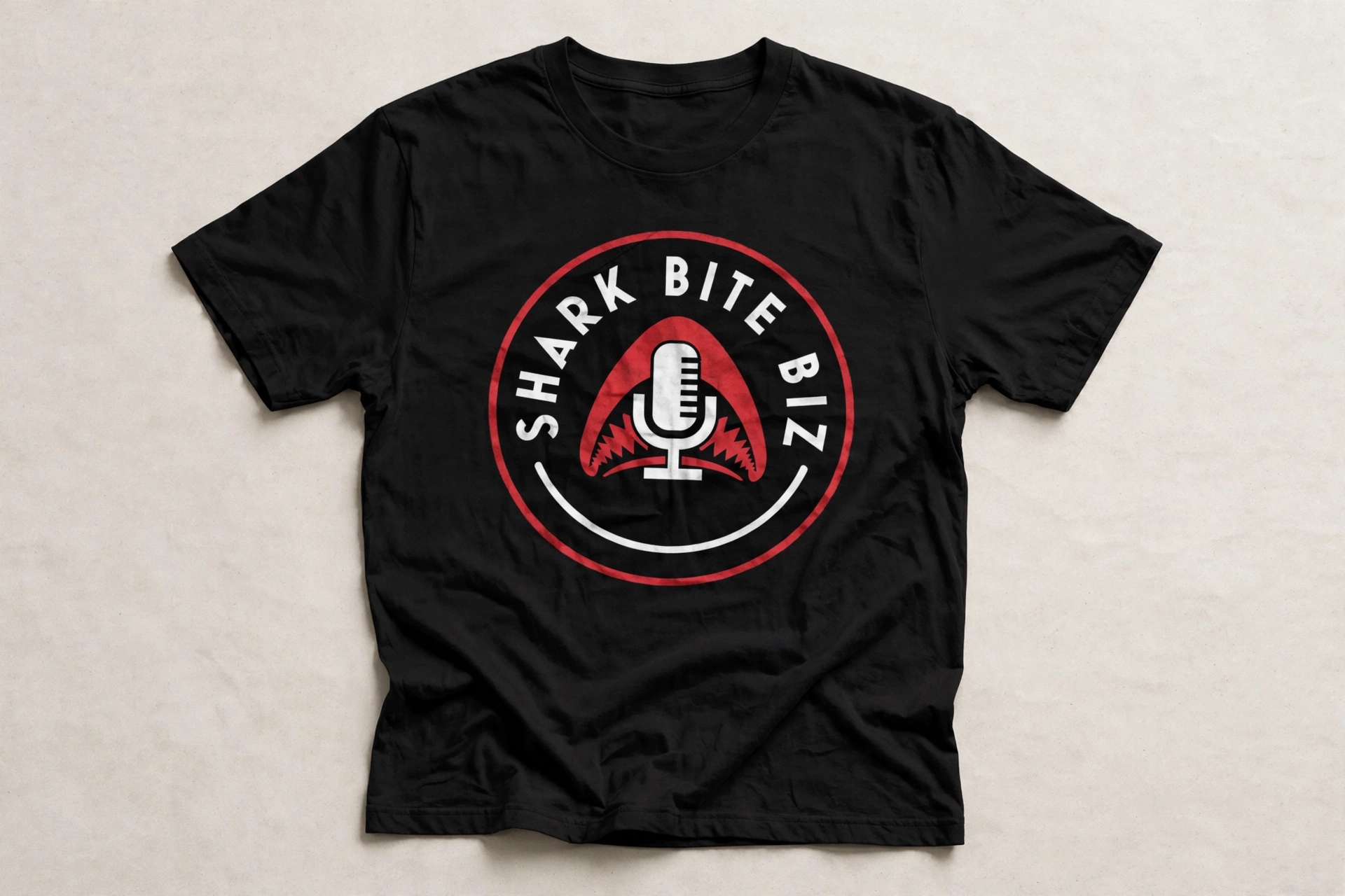 Shark Bite Biz tee — black shirt with the official Shark Bite Biz logo