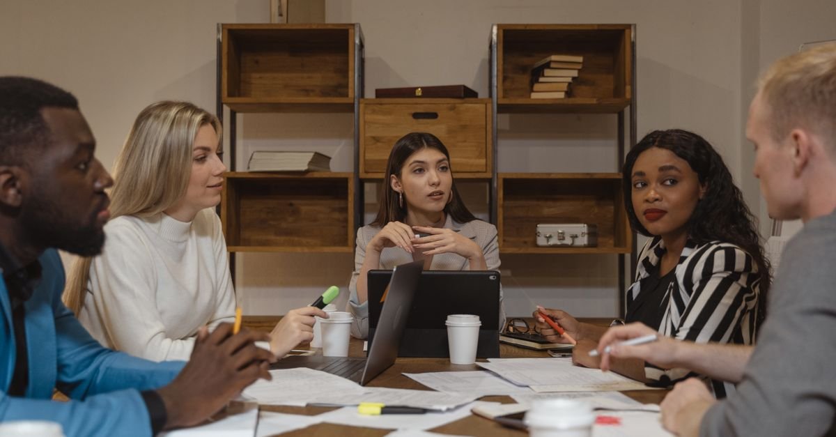 Business meeting around a conference table