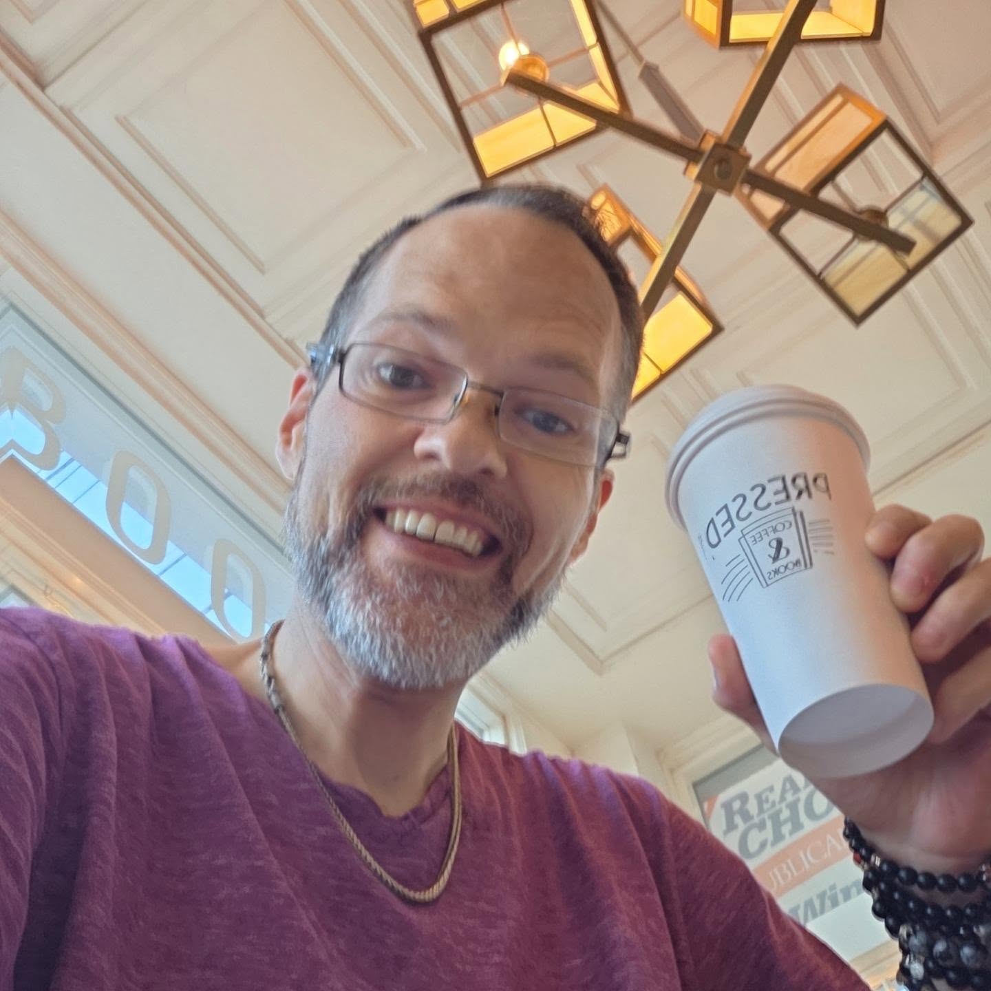 David Strausser holding a coffee cup